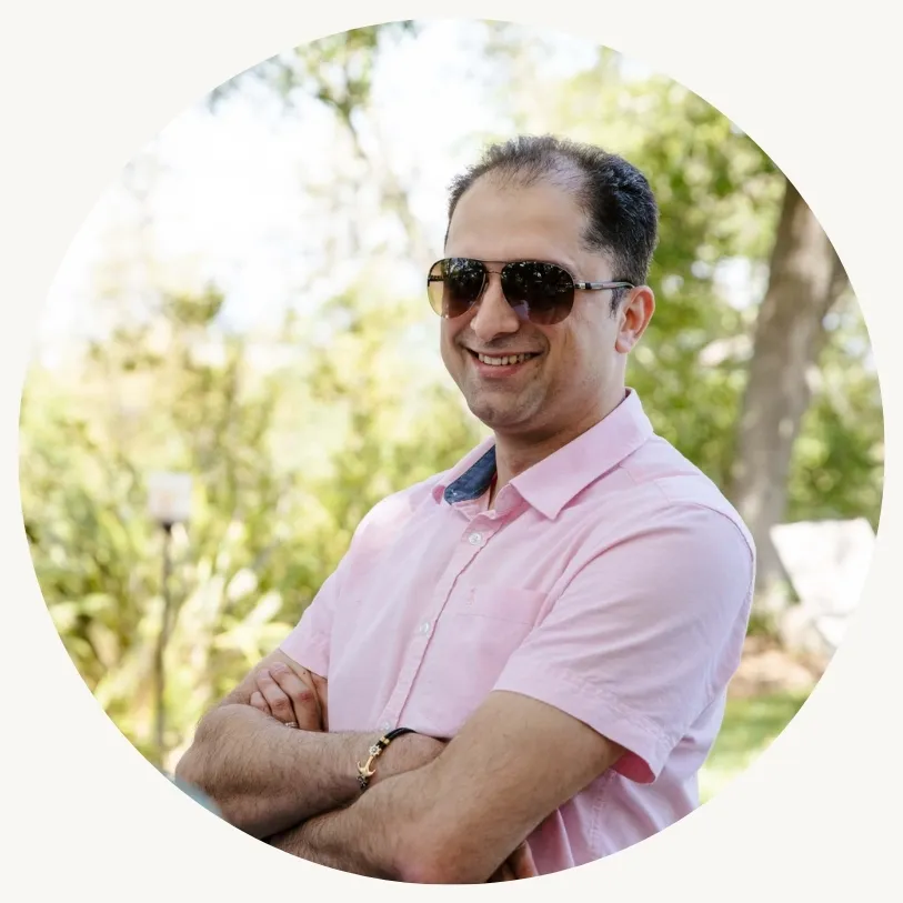 Mike Ketabforoosh smiling in sunglasses and a pink shirt