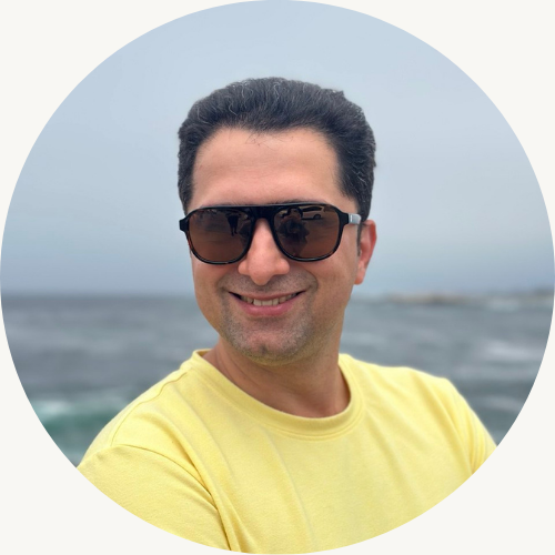 Mike Ketabforoosh, Product manager with thinning brown hair in pink shirt and sunglasses